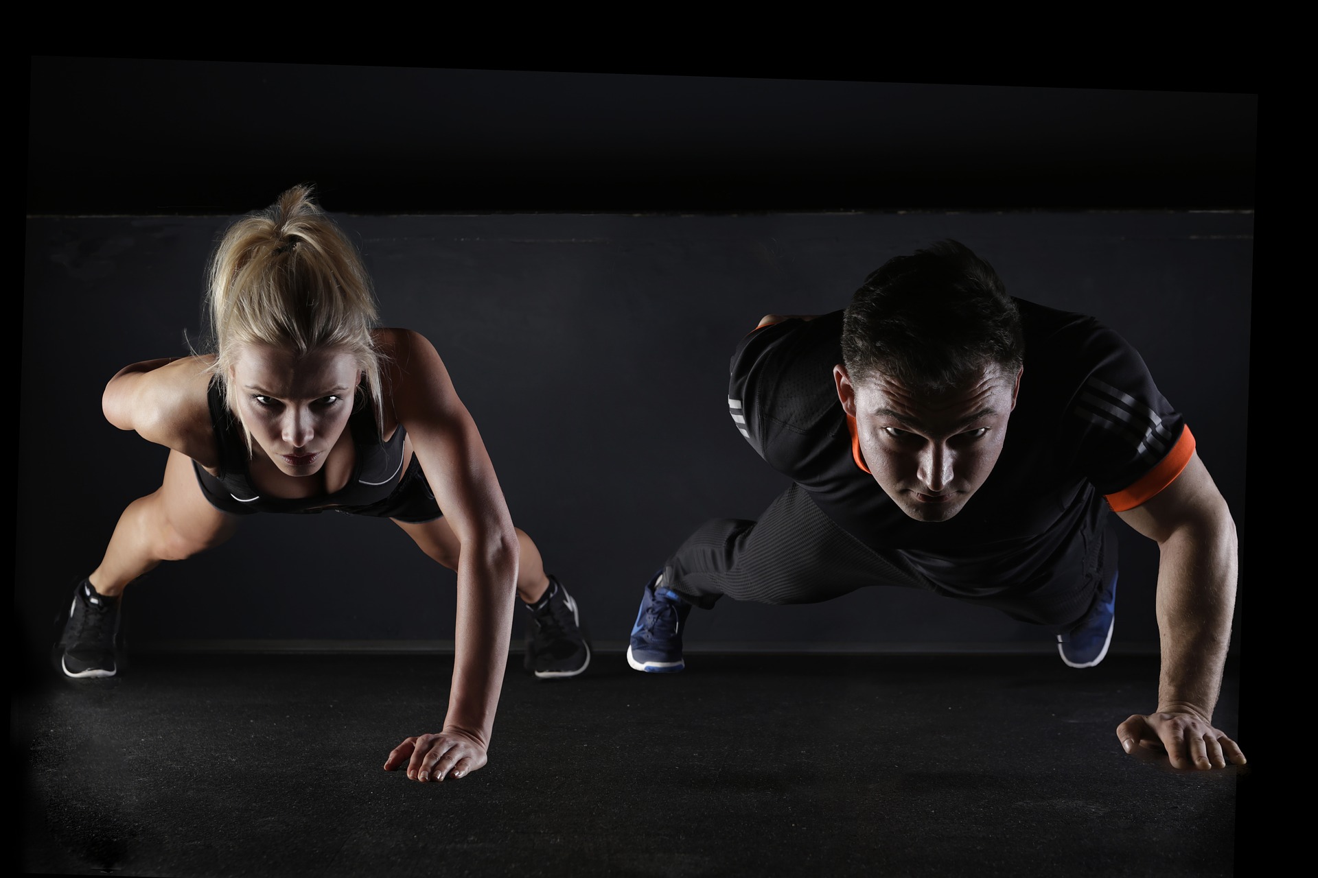 Man and woman exercising to keep fit